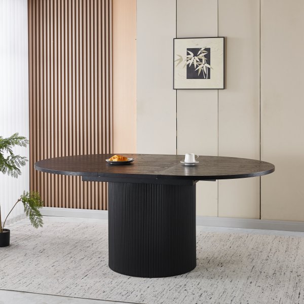 F�rl�ngningsbart runt matbord 140�180 cm i svartbetsad ek med plats f�r 6�8 personer | Astrid
